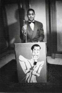 Dizzy Gillespie with a picture of Cab Calloway, 1939