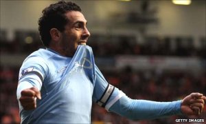 Carlos Tevez celebrates a goal over Blackpool