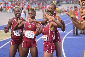 Achieving women: Athletes from Holmwood Technical High School celebrate as they win the Jamaican Girls' Athletics Championships for the ninth consecutive year. (Photo: newsamericasnow.com)