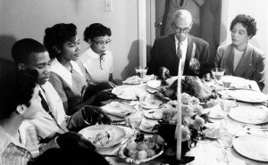 Little Rock Nine students eat Thanksgiving dinner with L. C. and Daisy Bates; November 1957. (Left to right): Carlotta Walls, Terrence Roberts, Melba Pattillo, Thelma Mothershed, L. C. Bates, and Daisy Bates. Photo by Will Counts; courtesy of the Arkansas History Commission