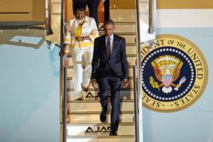 Rep. Yvette Clarke accompanies President Obama down the steps of Air Force One. (AP Photo/Ricardo Arduengo) 