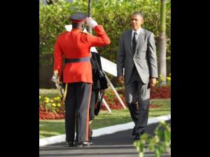 Colonel Daniel Pryce salutes US President Barack Obama at National Heroes Park on Thursday. (Photo: Jermaine Barnaby/Gleaner)