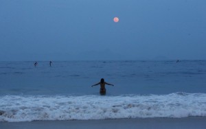 Not a spectacular super moon image, but atmospheric: Copacabana Beach in Rio de Janeiro, Brazil. (Photo by Mario Tama/Getty Images)