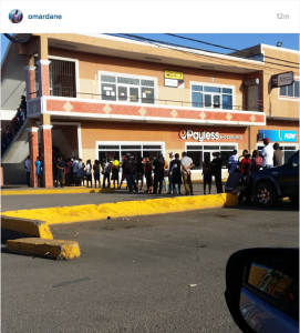 Sign of the times: An early morning line forms in May Pen, Clarendon outside the Western Union. Posted by a tweep.