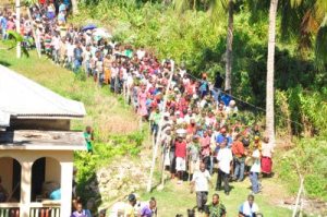 A Maroon procession makes its way from rituals at the Kindah Tree to the center of Accompong Town in St. Elizabeth on January 6. (Photo: Jamaica Observer)