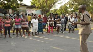 Good to see dialogue: Members of the Police High Command and the Community Safety and Security Branch met with residents of Rose Town recently to deal with pressing safety and security concerns amidst heightened tension in the community. (Photo: Loop Jamaica)