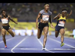 Elaine Thompson (centre) powers to a win in the women's 100m at the JAAA/Supreme Ventures National Senior Championships in 10.70 seconds. Christania Williams (right) finished second with Simone Facey coming fifth. (Photo: Ricardo Makyn/Gleaner)