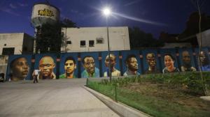 Dusk descends on the new mural depicting members of the Olympic Refugee Team. (Photo: Getty Images)