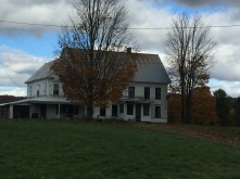 An old farmhouse on a dark day in Vermont.