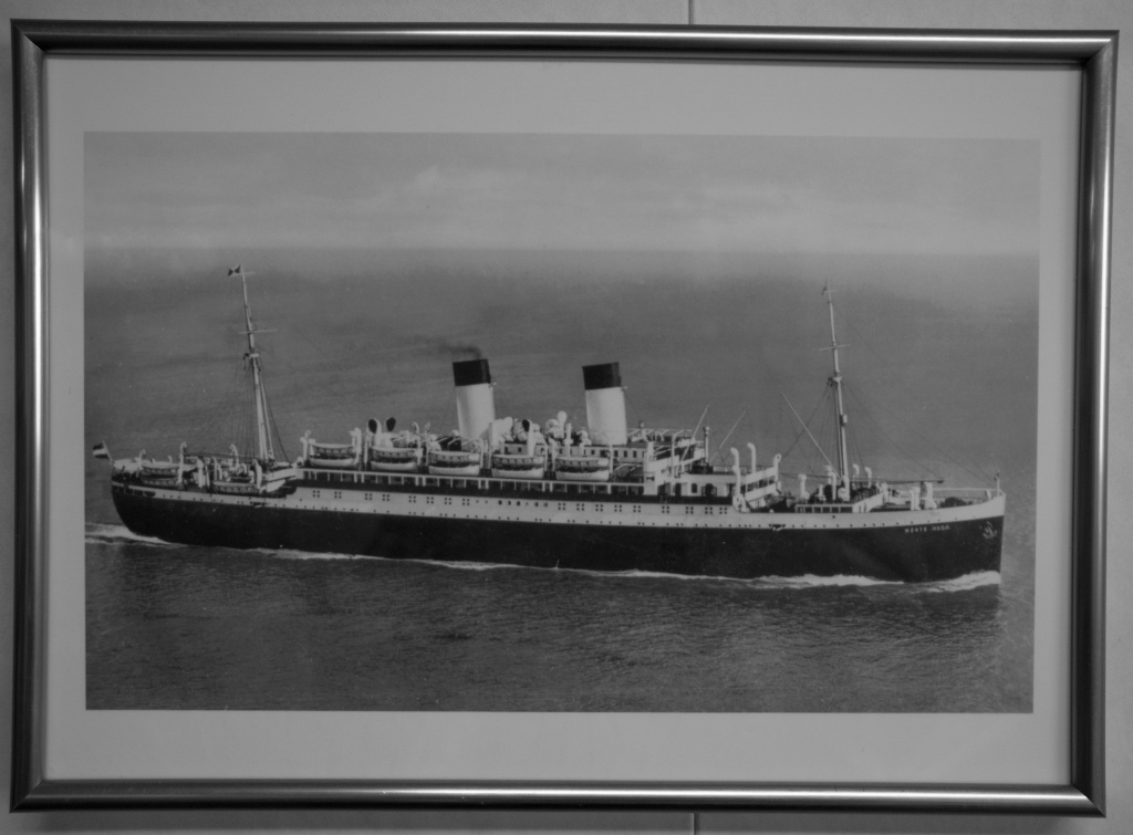 A picture of the vessel, the Empire Windrush, which was originally a German passenger liner and subsequently a troopship. The ship brought one of the first large groups of post-war West Indian immigrants to the UK in 1948.